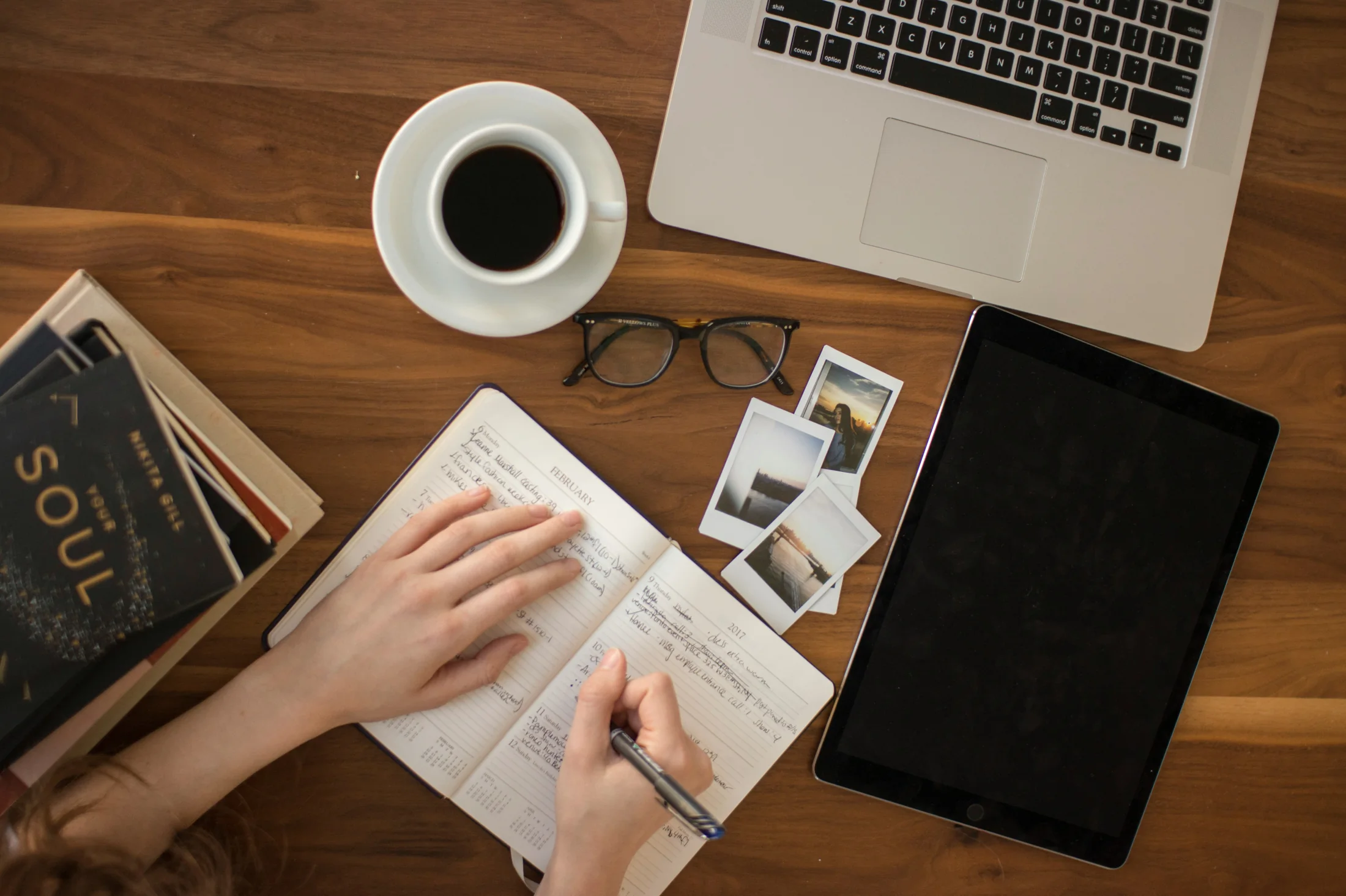 An open journal on a desk, attached to a written memory